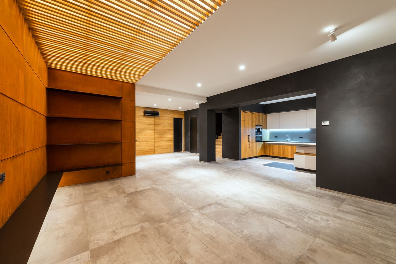 faq-img Bright empty modern interior with wooden accents and minimal design, perfect for new home decor.